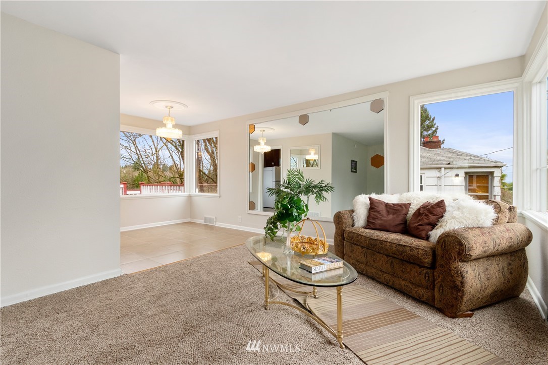 10651 Rustic Road South Seattle, WA 98178 - Photo 5 of 34 a living room with furniture and a large window