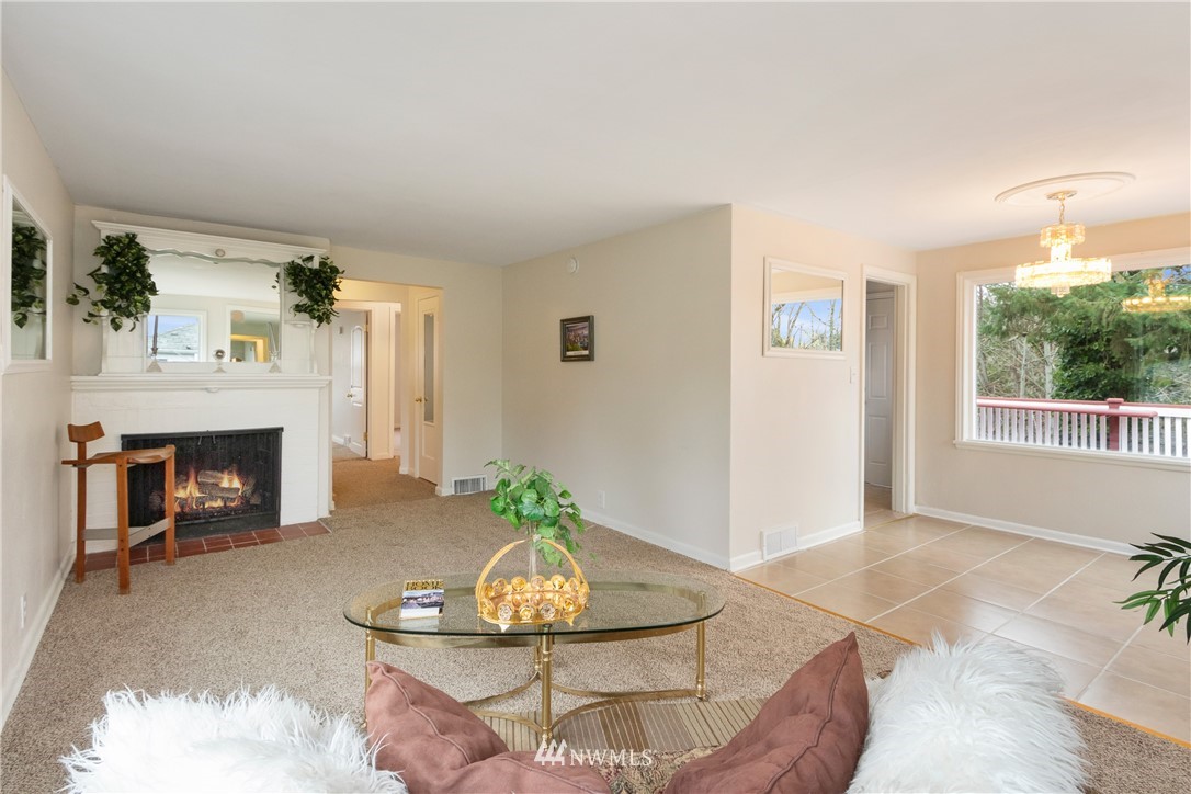 10651 Rustic Road South Seattle, WA 98178 - Photo 6 of 34 a living room with furniture and a fireplace