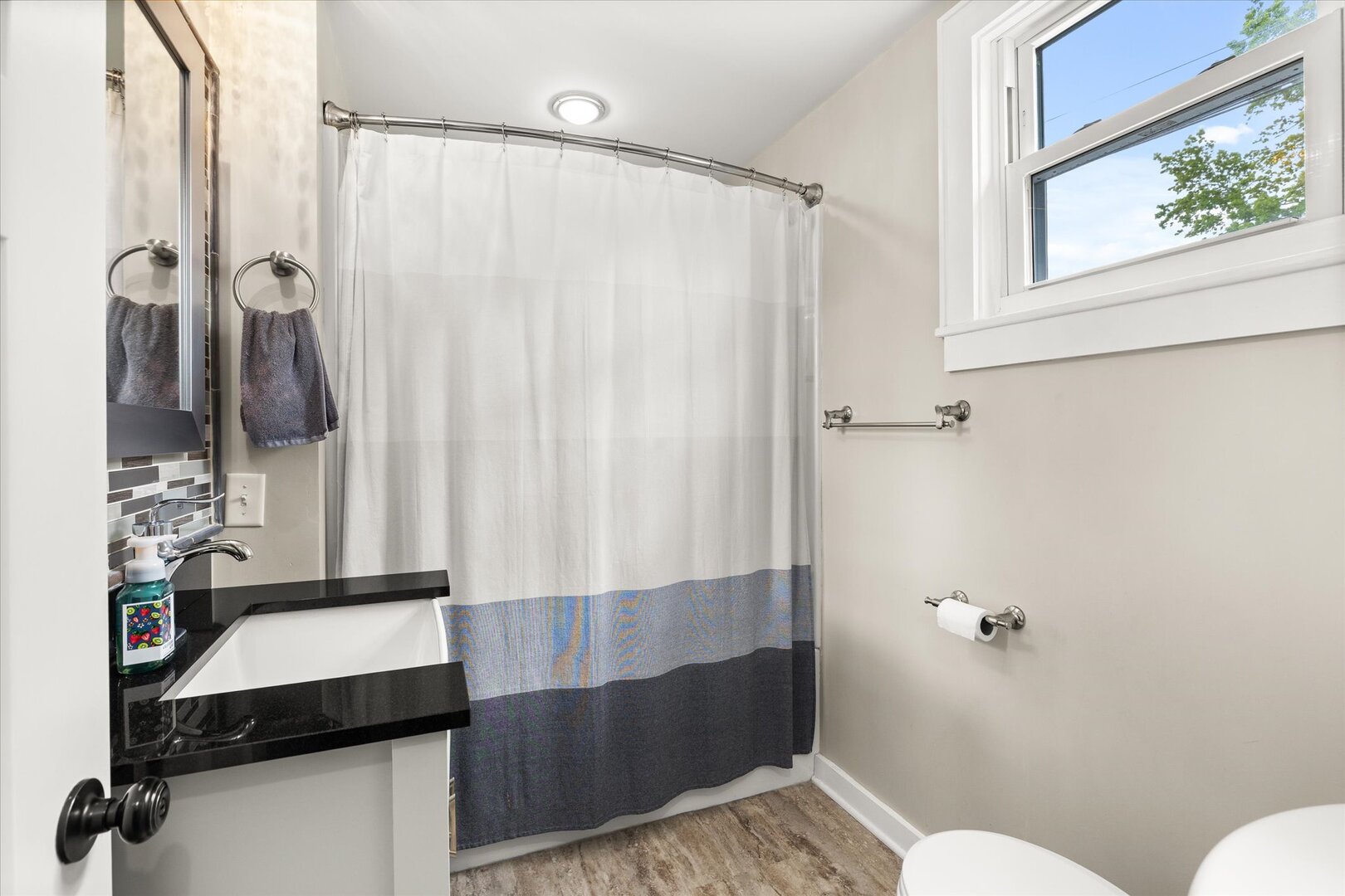 742 Chambers Street Ottawa, IL 61350 - Photo 21 of 39 a bathroom with a sink and a shower curtain