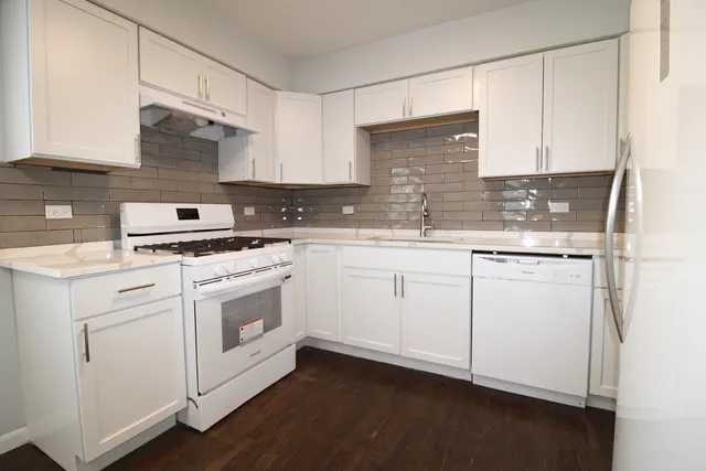 a view of walk in closet with wooden floor