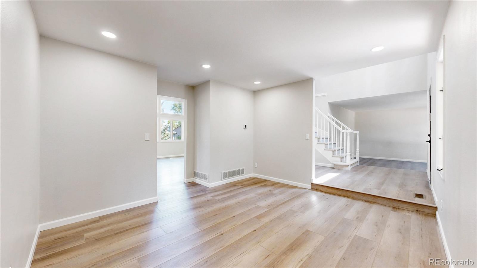 6265 Cornell Court Highlands Ranch, CO 80130 - Photo 14 of 41 wooden floor in an empty room with a window