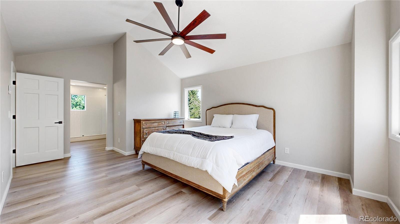 6265 Cornell Court Highlands Ranch, CO 80130 - Photo 17 of 41 a bedroom with a bed and wooden floor