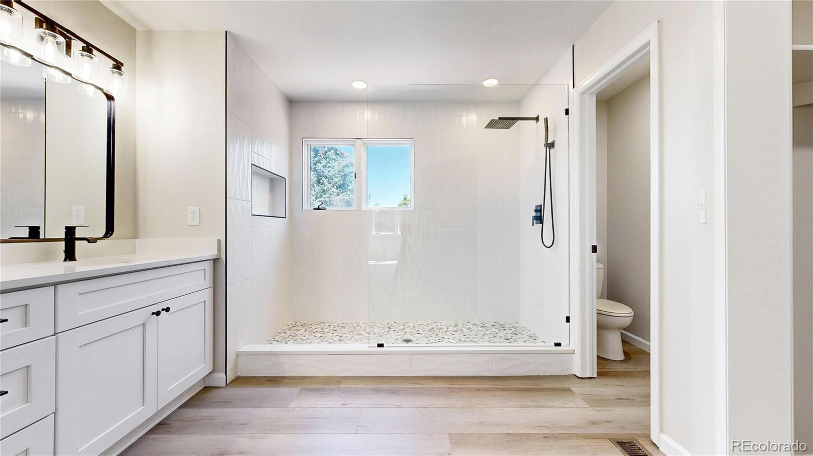 6265 Cornell Court Highlands Ranch, CO 80130 - Photo 18 of 41 a bathroom with a bathtub and a shower