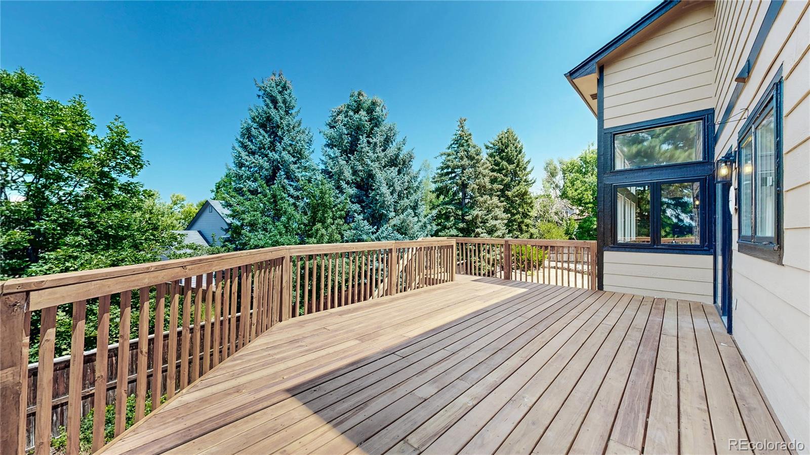 6265 Cornell Court Highlands Ranch, CO 80130 - Photo 30 of 41 a balcony with wooden floor and outdoor space