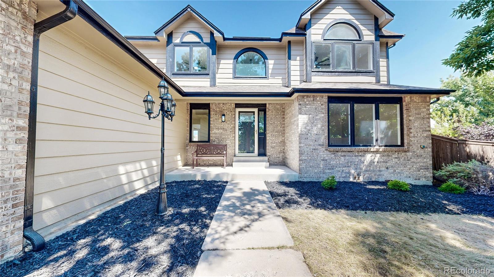 6265 Cornell Court Highlands Ranch, CO 80130 - Photo 31 of 41 a front view of a house with a yard