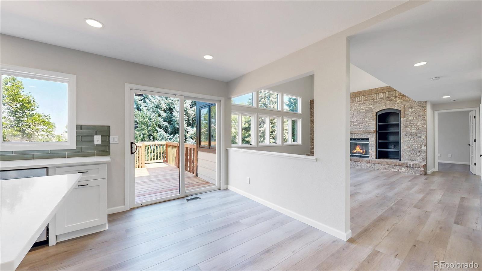 6265 Cornell Court Highlands Ranch, CO 80130 - Photo 6 of 41 an empty room with wooden floor and windows