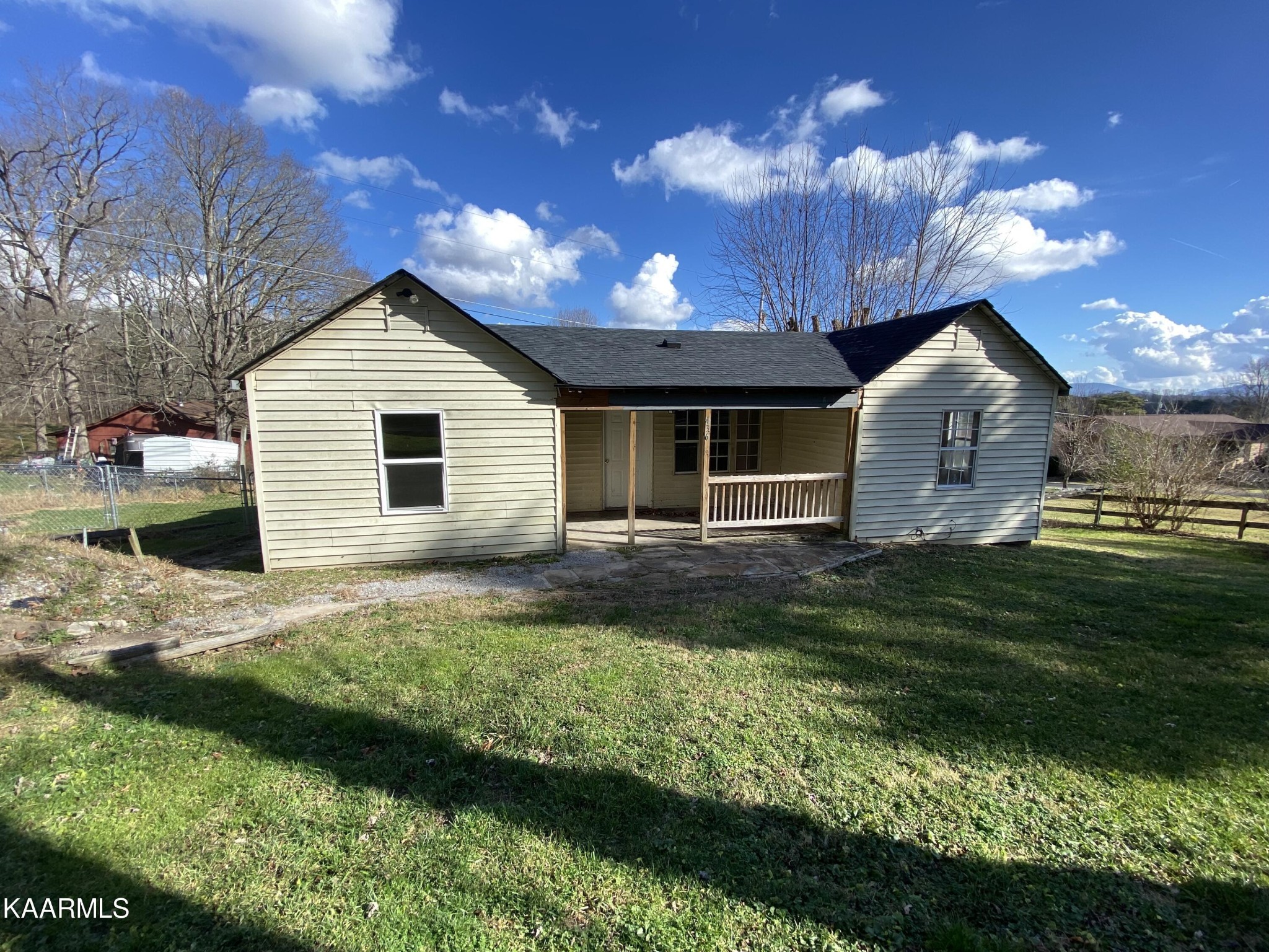 436 Fox Creek Road Crossville, TN 38571 - Photo 1 of 22 a front view of a house with a garden