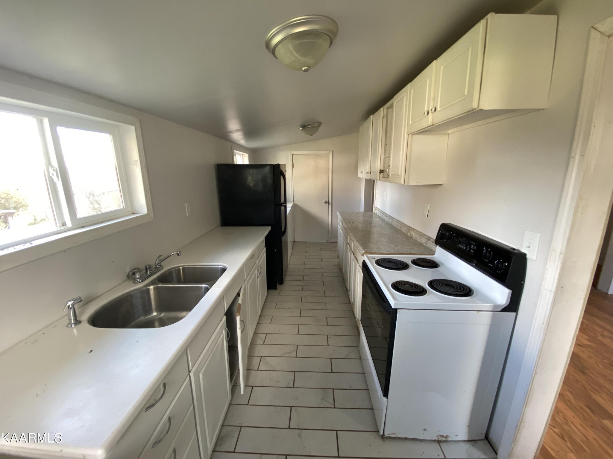 436 Fox Creek Road Crossville, TN 38571 - Photo 12 of 22 a kitchen that has a sink and a stove