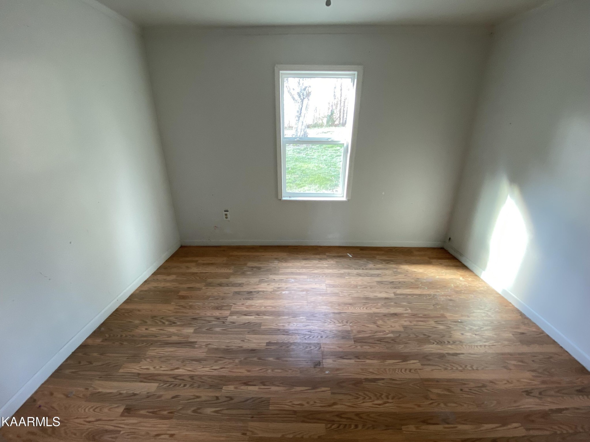 436 Fox Creek Road Crossville, TN 38571 - Photo 15 of 22 an empty room with wooden floor and windows