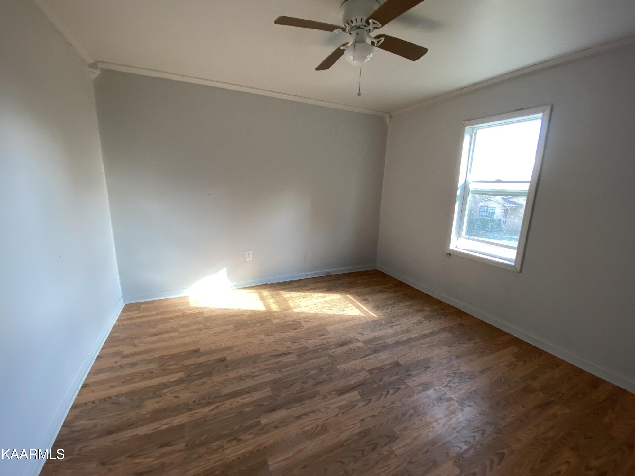 436 Fox Creek Road Crossville, TN 38571 - Photo 19 of 22 a view of empty room with wooden floor and fan