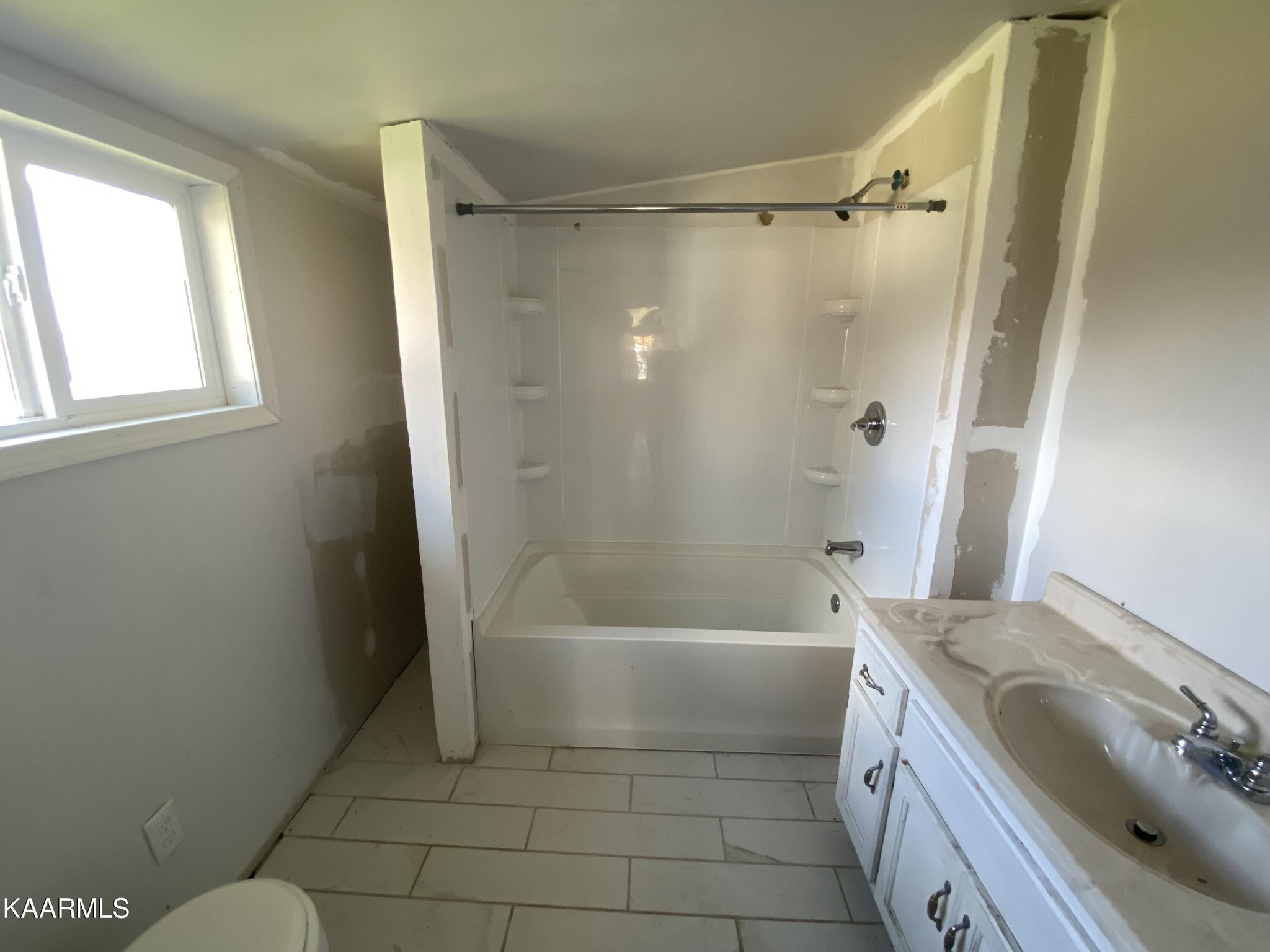 436 Fox Creek Road Crossville, TN 38571 - Photo 20 of 22 a bathroom with a granite countertop sink toilet and shower