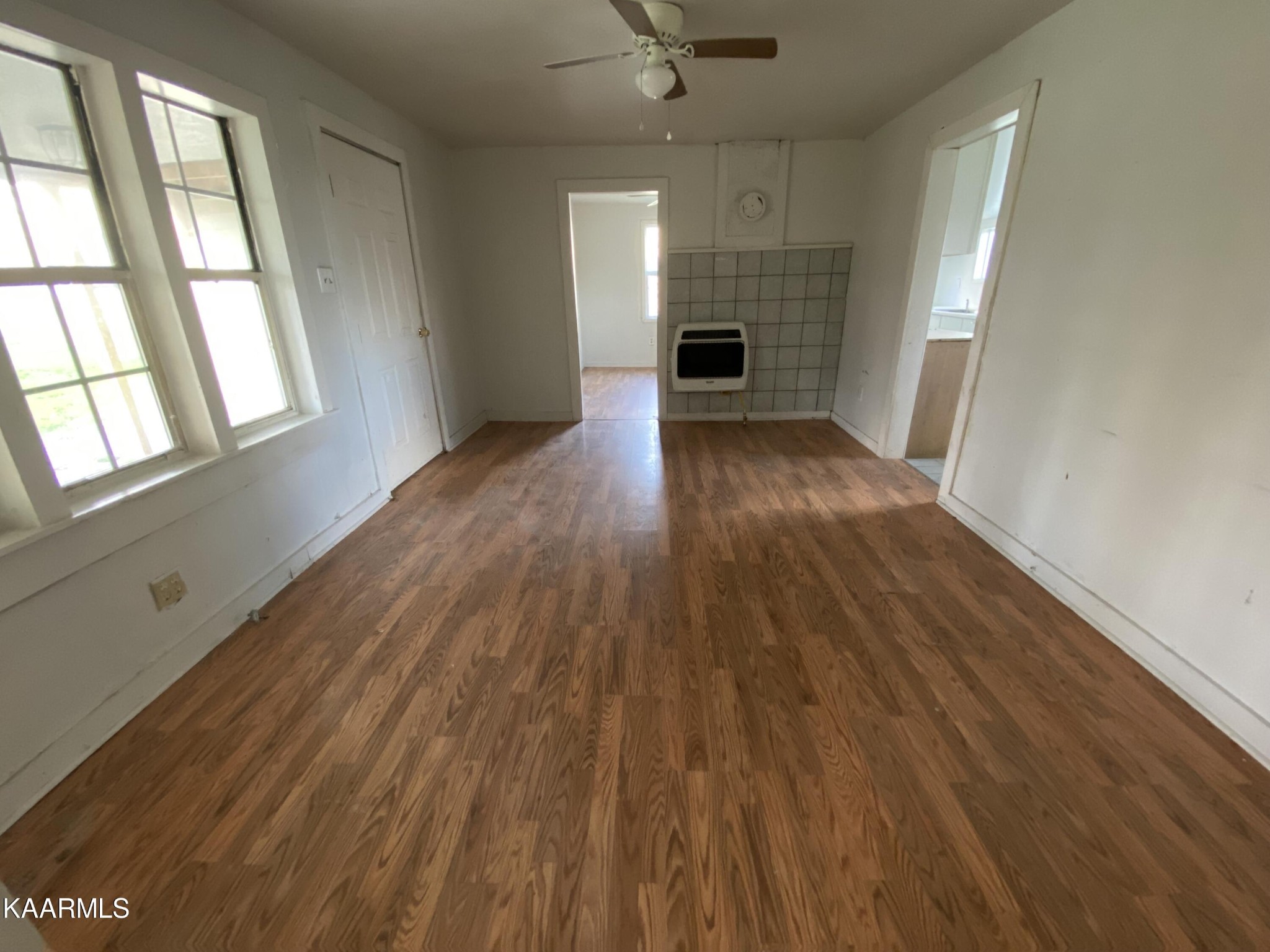 436 Fox Creek Road Crossville, TN 38571 - Photo 10 of 22 an empty room with wooden floor and windows