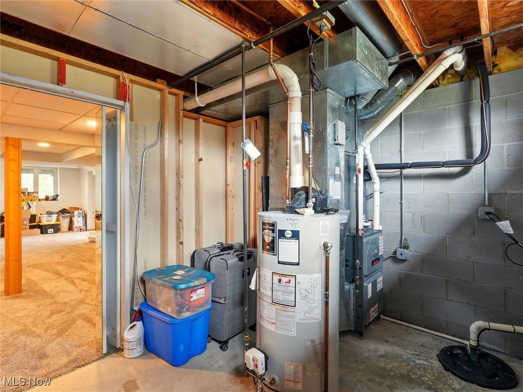 2068 Chimney Ridge Drive Madison, OH 44057 - Photo 31 of 37 Utility room featuring water heater