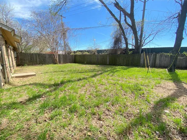 a backyard of a house with lots of green space