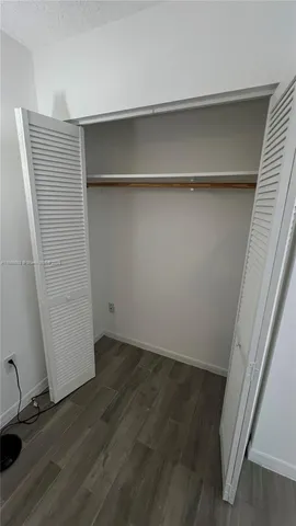 a view of an empty walk in closet