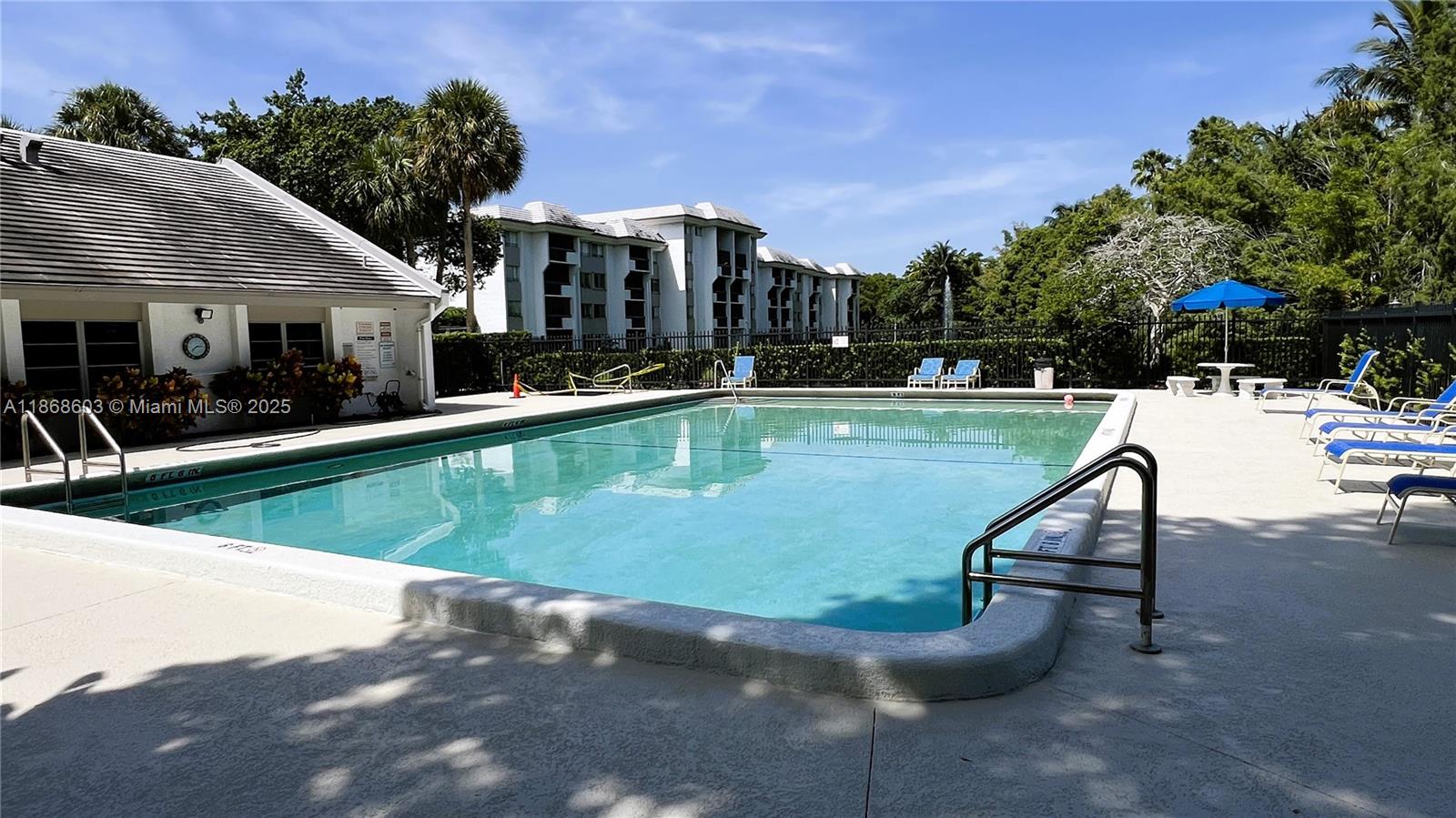 711 North Pine Island Road, Unit 211 Plantation, FL 33324 - Photo 16 of 16 a view of a swimming pool and lounge chairs