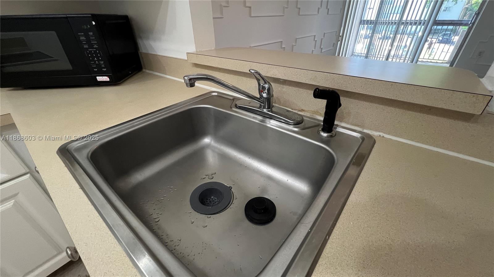 711 North Pine Island Road, Unit 211 Plantation, FL 33324 - Photo 6 of 16 a close view of sink