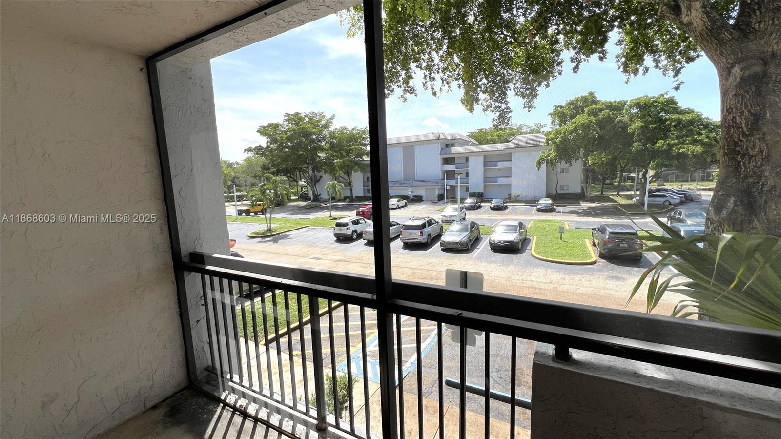 711 North Pine Island Road, Unit 211 Plantation, FL 33324 - Photo 8 of 16 a view of a porch with chairs and wooden floor