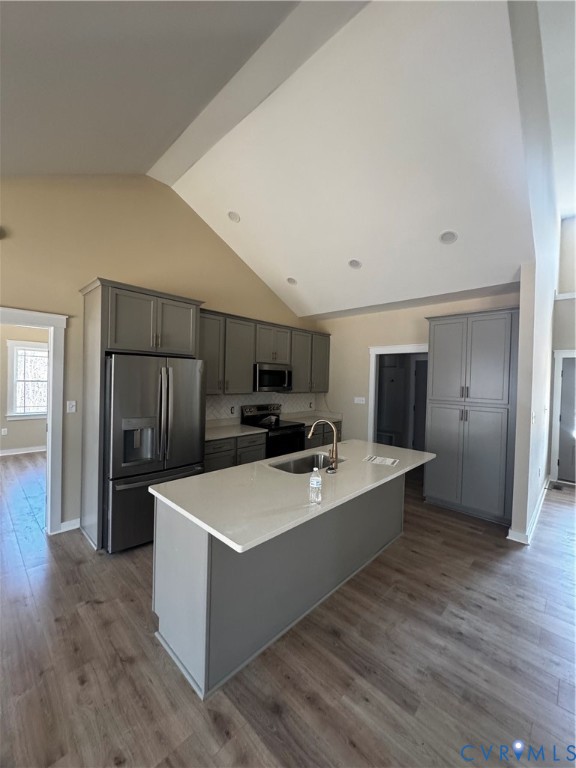 239 Bumpass Road Bumpass, VA 23024 - Photo 4 of 19 a large room with kitchen island stainless steel appliances wooden cabinets and entryway