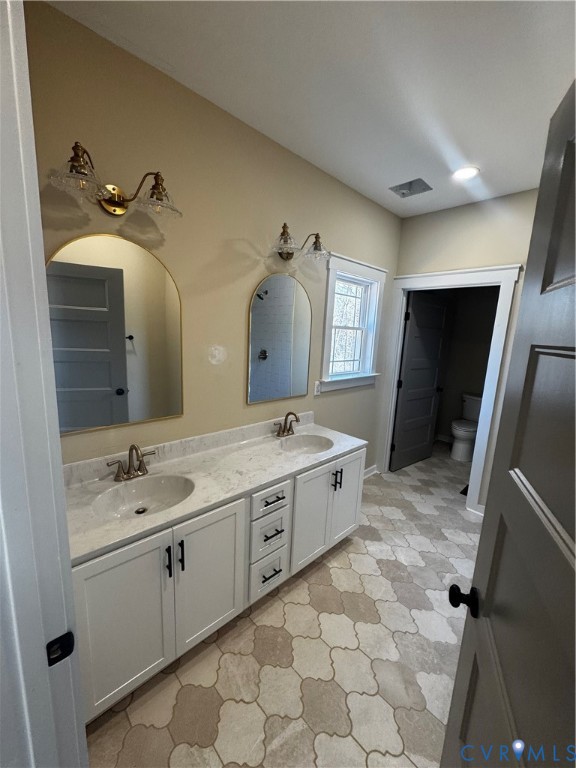 239 Bumpass Road Bumpass, VA 23024 - Photo 8 of 19 a spacious bathroom with a granite countertop sink and a mirror