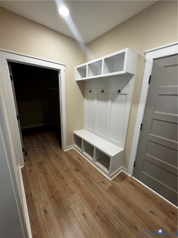 239 Bumpass Road Bumpass, VA 23024 - Photo 10 of 19 a view of an empty room with wooden floor and stairs