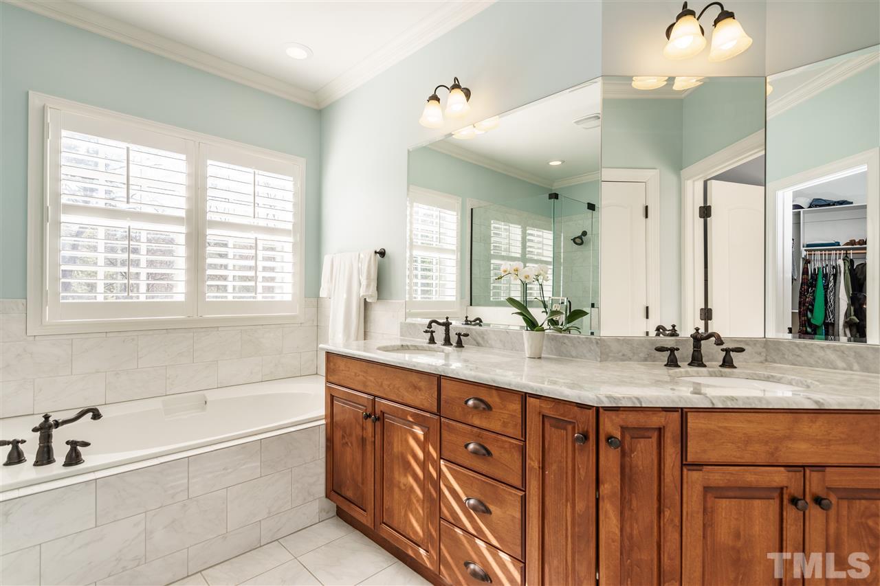 2810 Anderson Drive Raleigh, NC 27608 - Photo 14 of 25 a bathroom with a granite countertop sink mirror bathtub and double