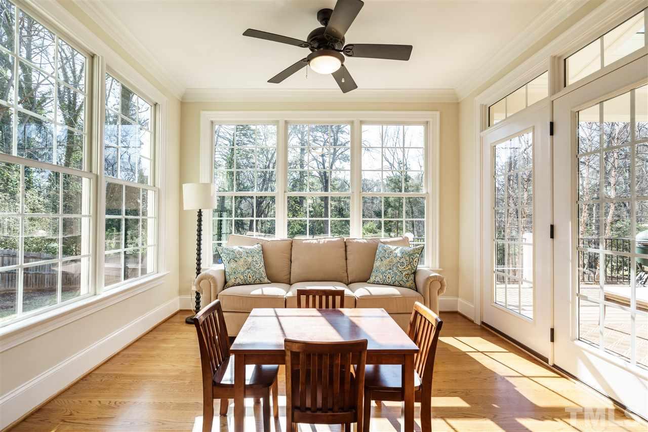 2810 Anderson Drive Raleigh, NC 27608 - Photo 8 of 25 a living room with furniture and a window