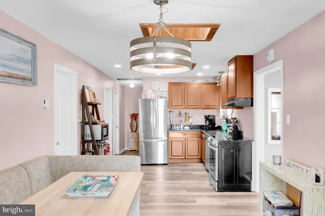 a view of a livingroom with furniture window and wooden floor