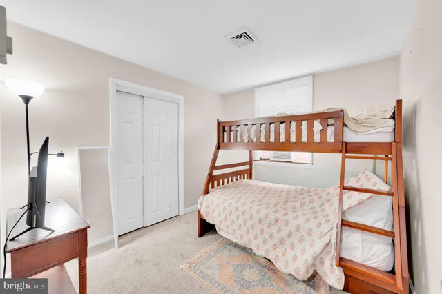 a bathroom with a sink a toilet and shower curtain