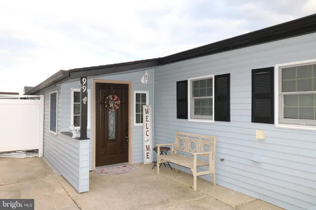 a view of a house with more windows and brick walls