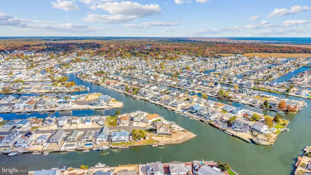 an aerial view of city and lake