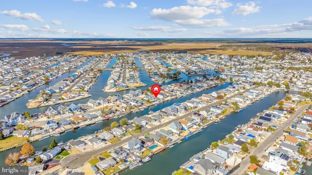 a view of a livingroom with furniture and a window