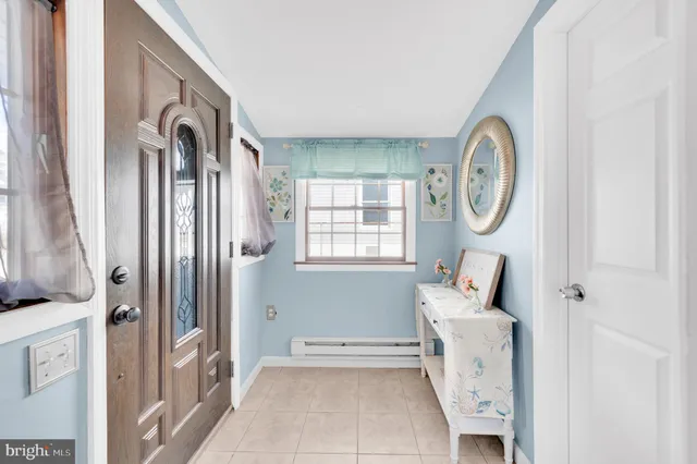 a living room with stainless steel appliances kitchen island granite countertop furniture and a kitchen view
