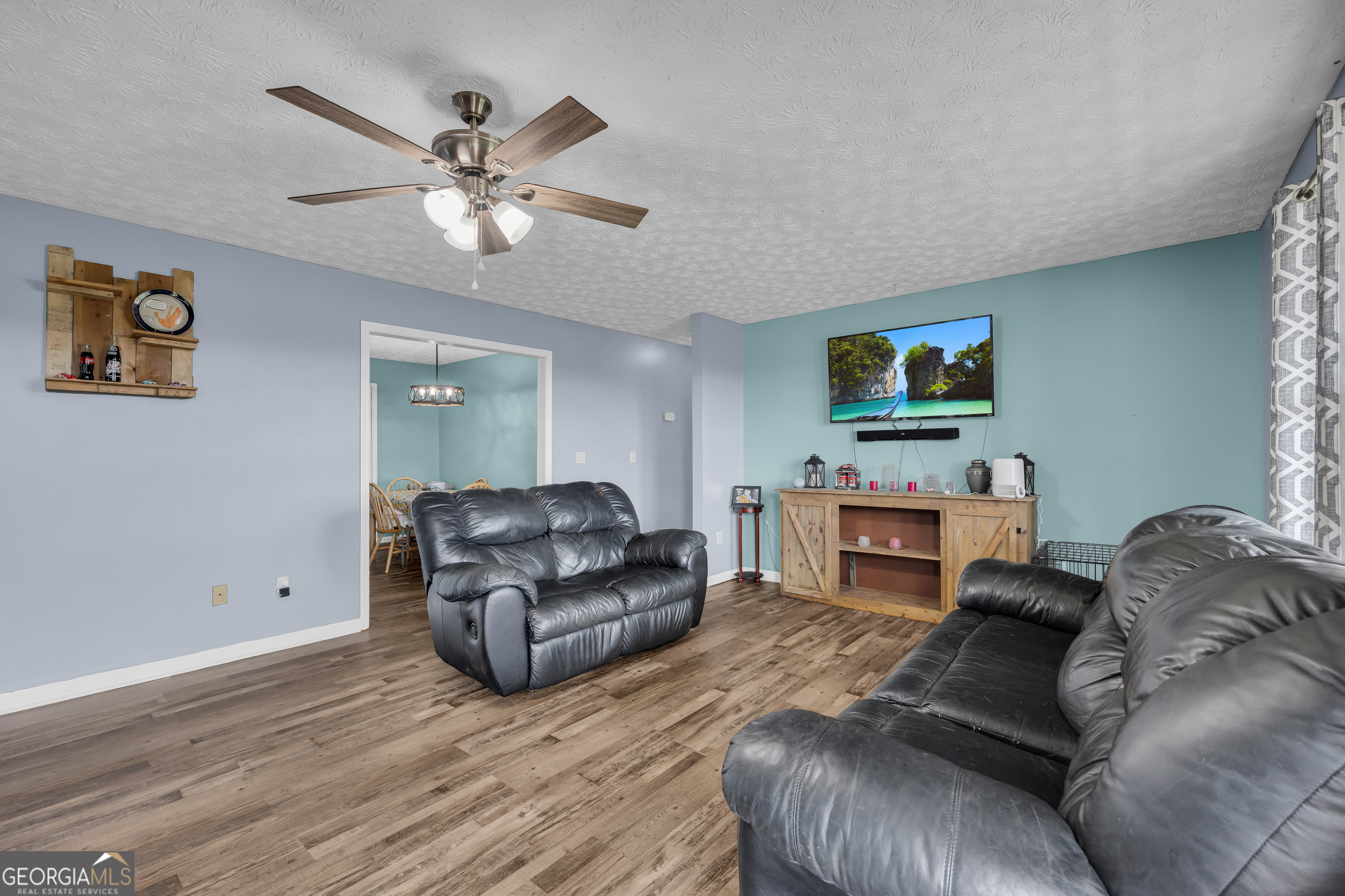 156 Shirley Road Royston, GA 30662 - Photo 6 of 29 a living room with furniture and a flat screen tv