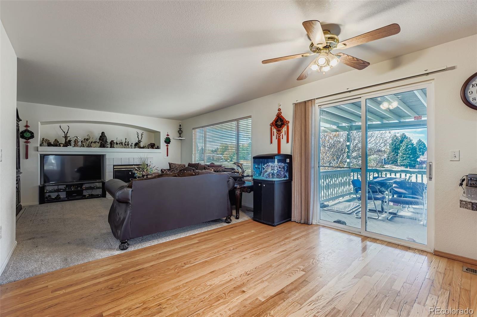 2743 South Waco Way Aurora, CO 80013 - Photo 11 of 28 a room with furniture and a fireplace