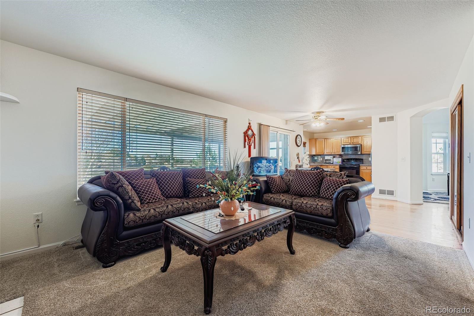 2743 South Waco Way Aurora, CO 80013 - Photo 12 of 28 a living room with furniture and a window