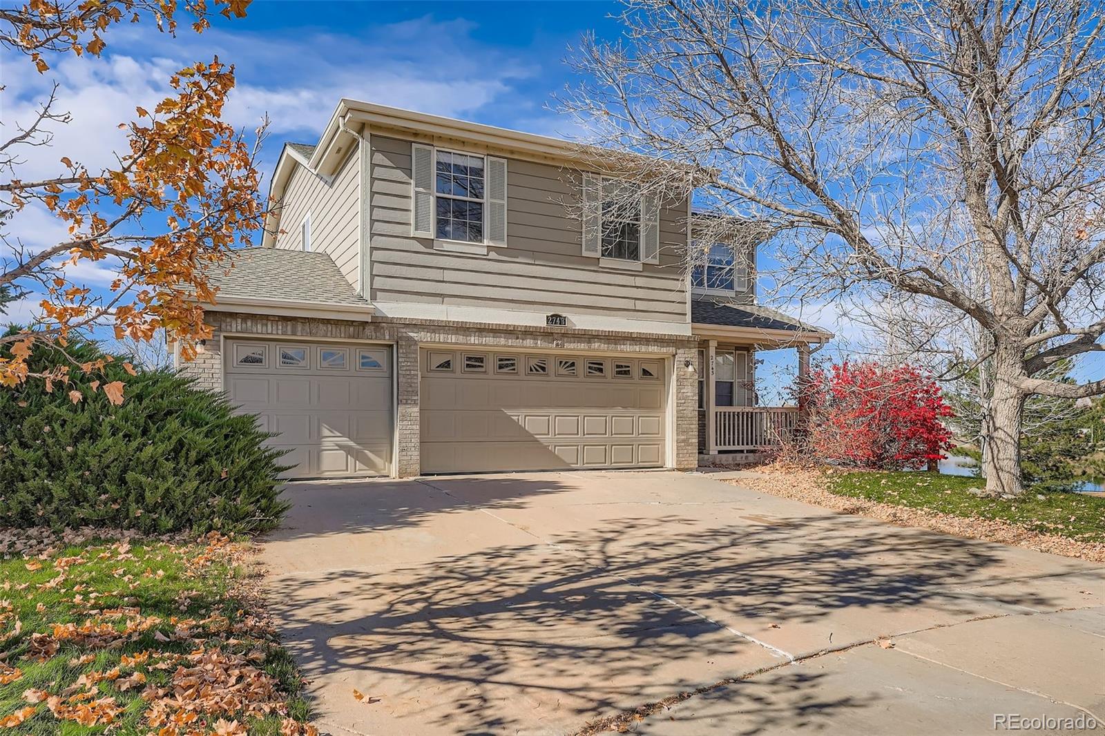 2743 South Waco Way Aurora, CO 80013 - Photo 2 of 28 a front view of a house with a yard