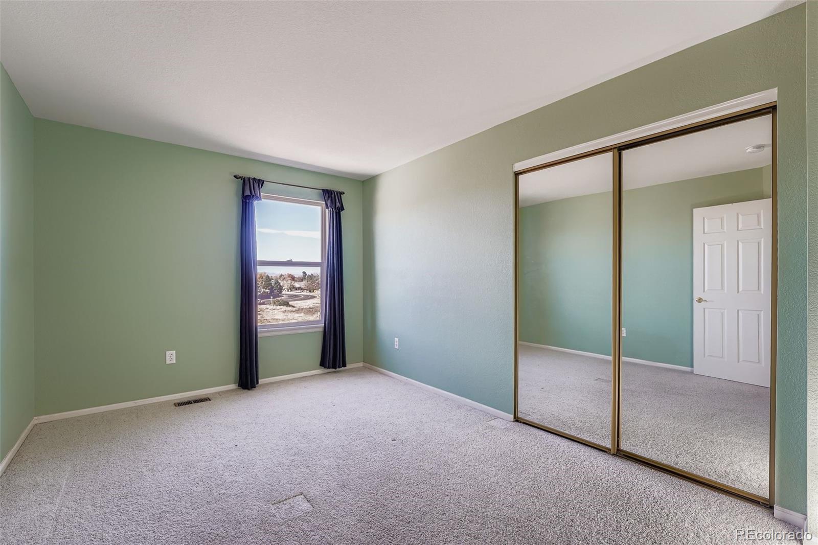 2743 South Waco Way Aurora, CO 80013 - Photo 21 of 28 a view of an empty room with window