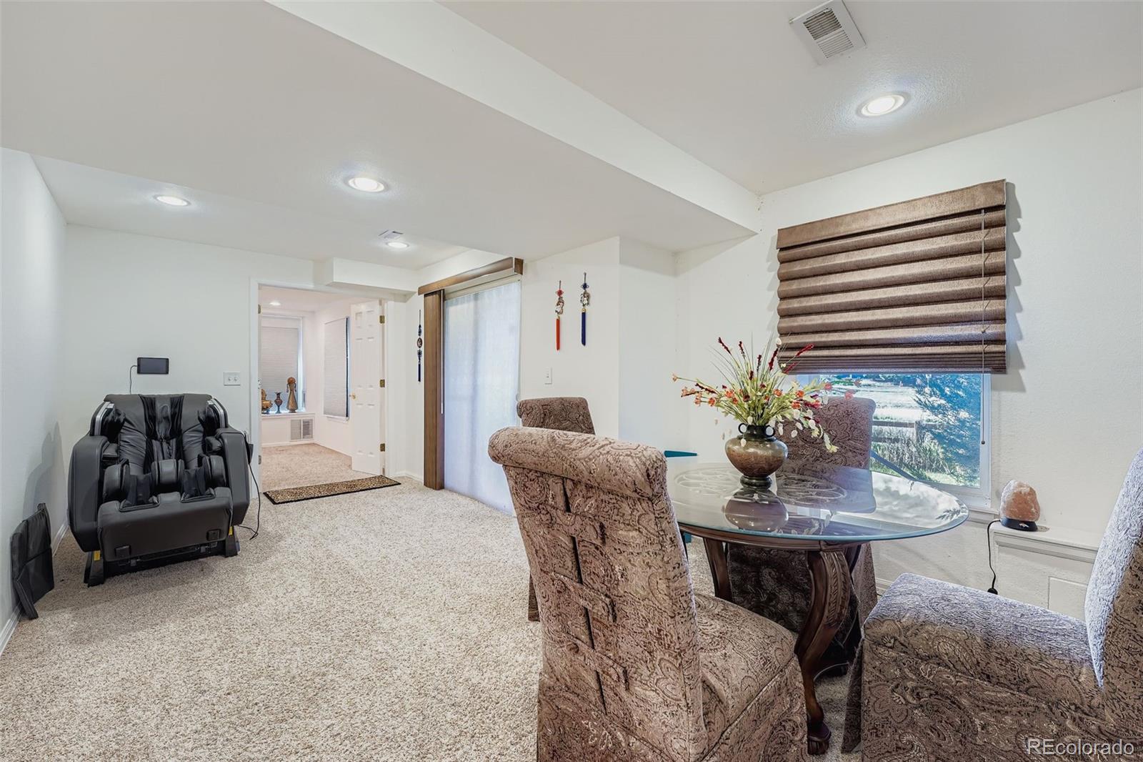 2743 South Waco Way Aurora, CO 80013 - Photo 25 of 28 a living room with furniture and a potted plant