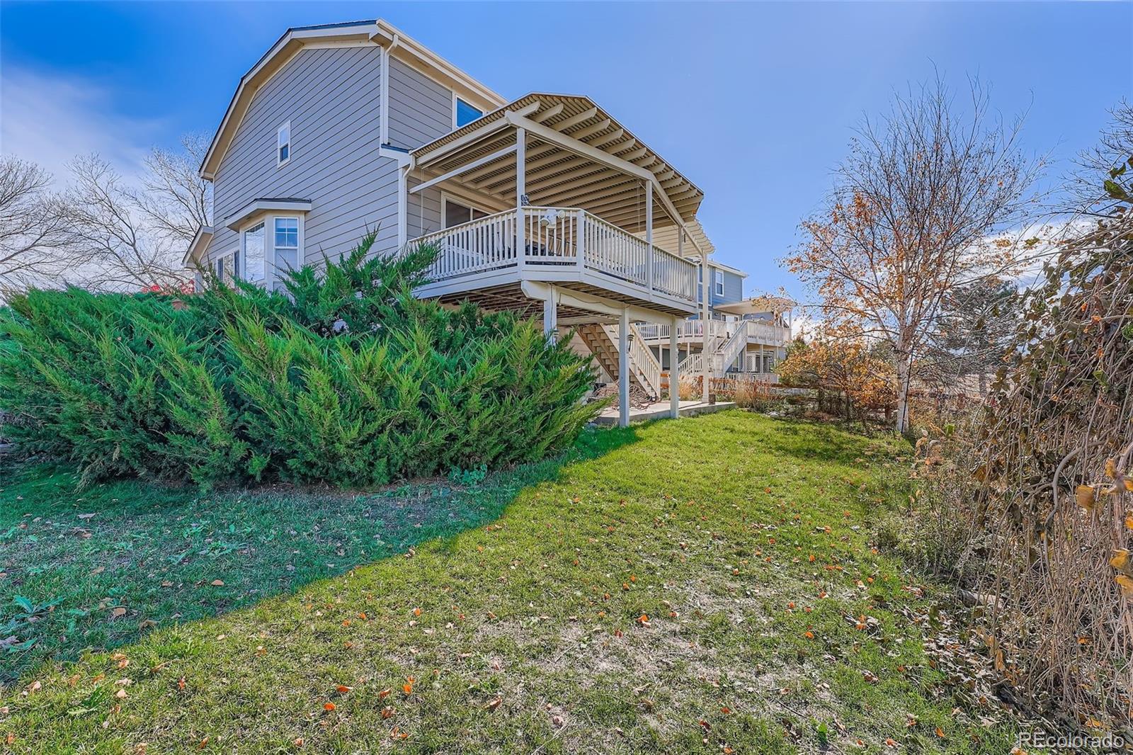 2743 South Waco Way Aurora, CO 80013 - Photo 28 of 28 a front view of a house with a yard