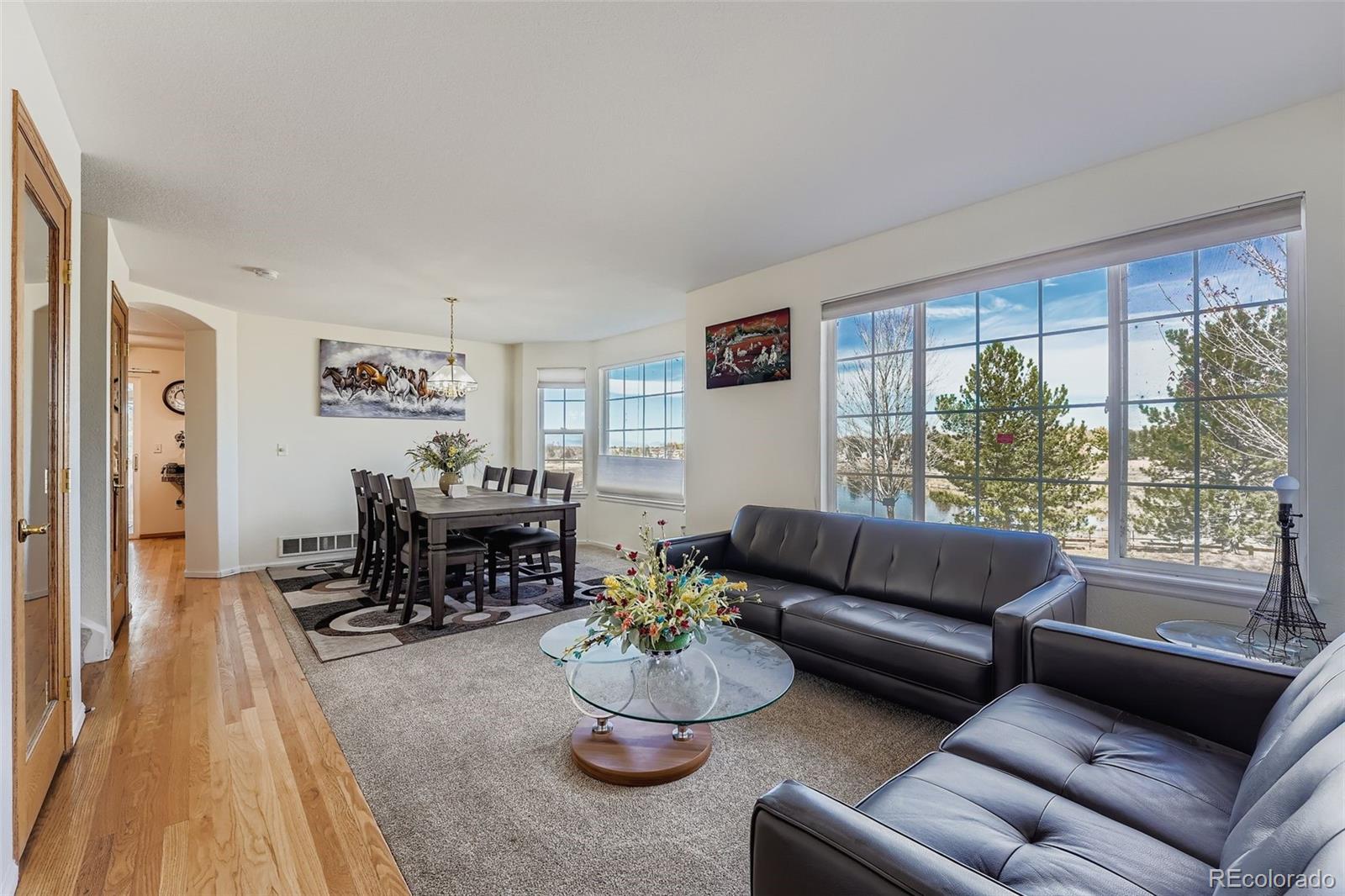 2743 South Waco Way Aurora, CO 80013 - Photo 4 of 28 a living room with furniture and a large window