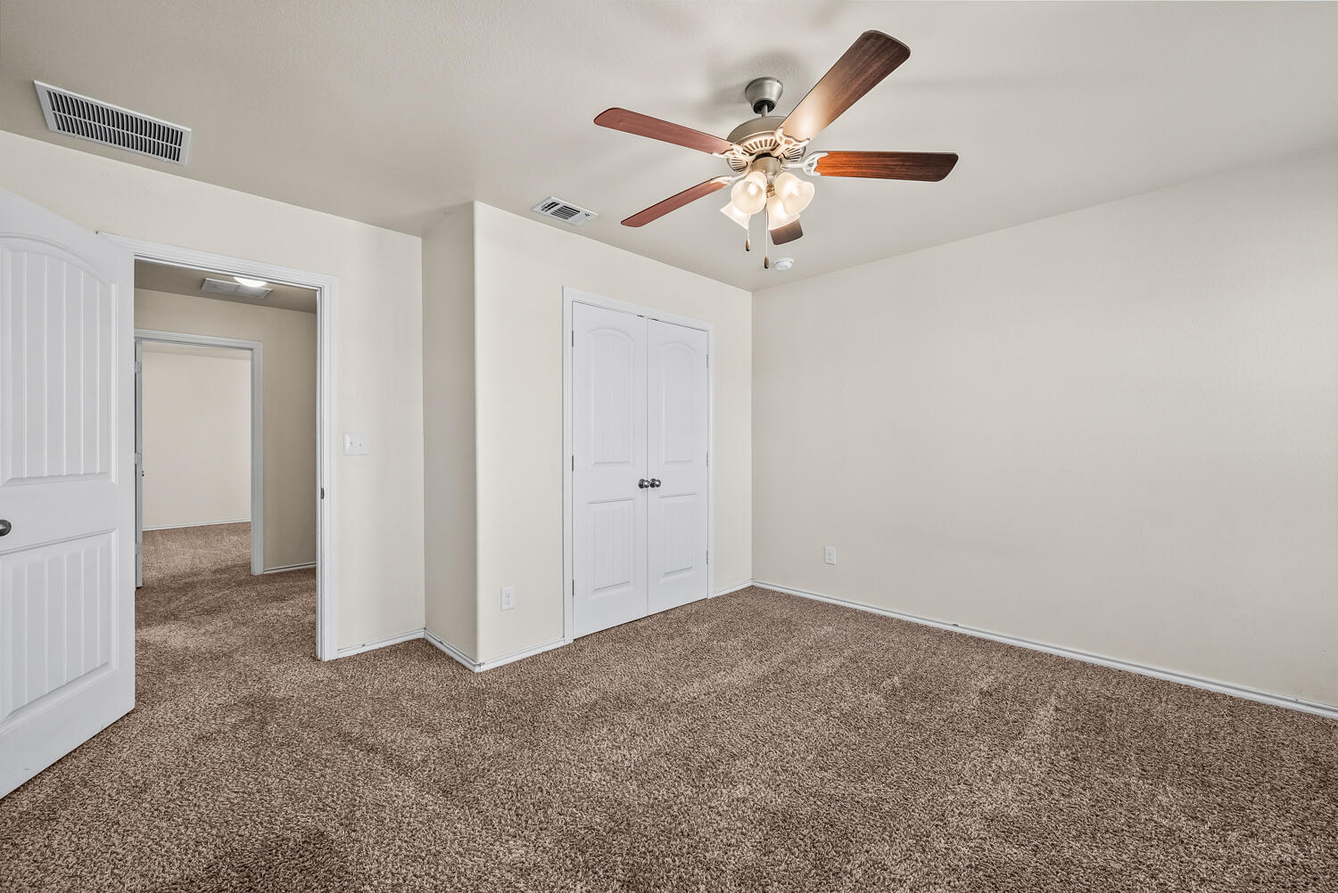 7027 37th Street Lubbock, TX 79407 - Photo 21 of 36 an empty room with a ceiling fan and a window