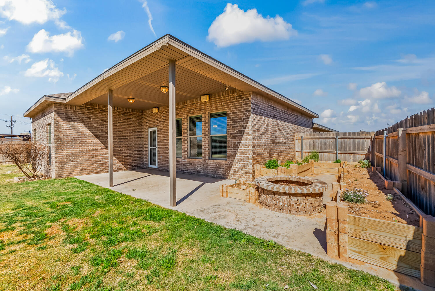 7027 37th Street Lubbock, TX 79407 - Photo 29 of 36 a patio with table and chairs