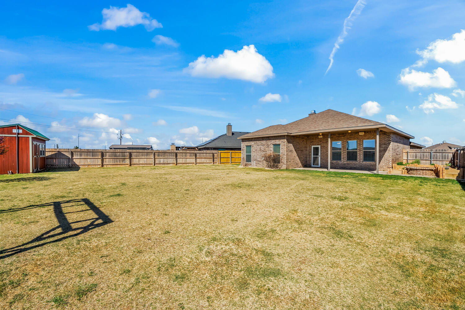 7027 37th Street Lubbock, TX 79407 - Photo 30 of 36 a front view of a house with swimming pool