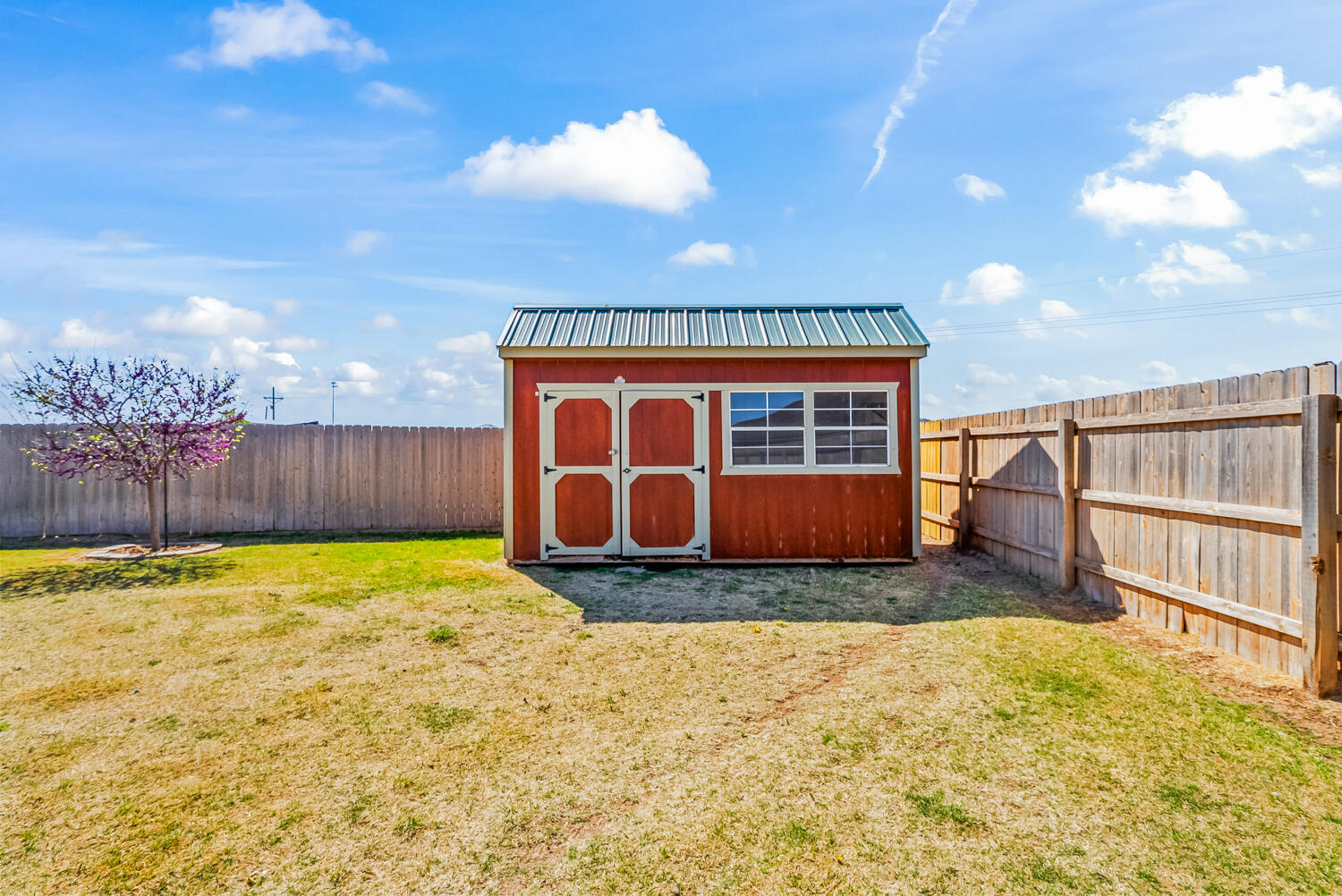 7027 37th Street Lubbock, TX 79407 - Photo 31 of 36 a view of an house with backyard and wooden fence