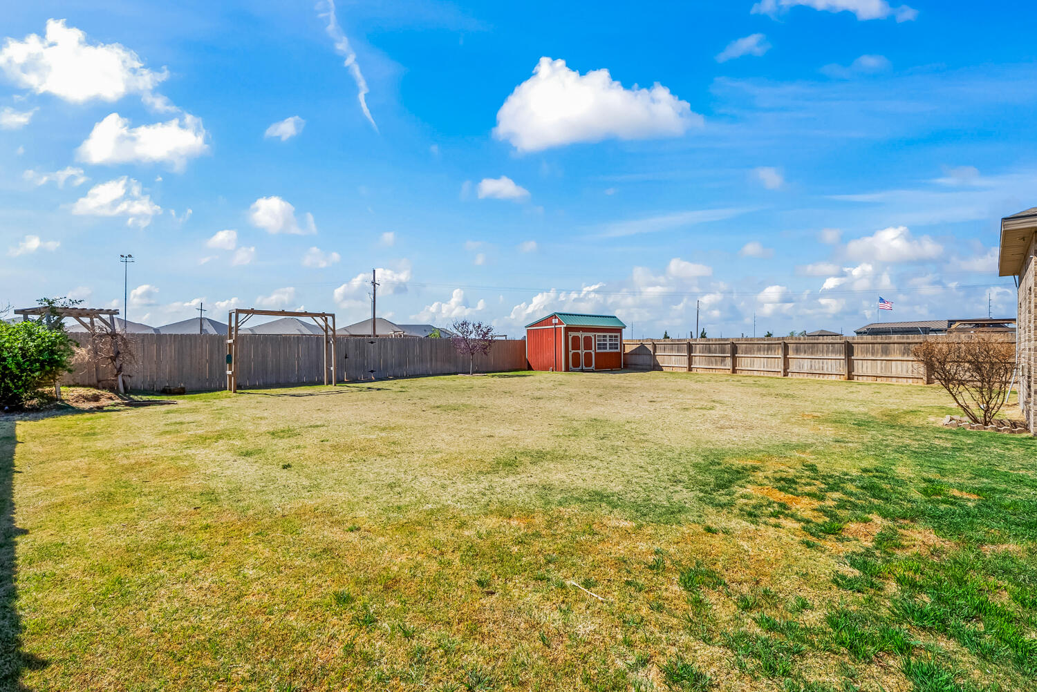 7027 37th Street Lubbock, TX 79407 - Photo 34 of 36 a swimming pool with yard in front of it