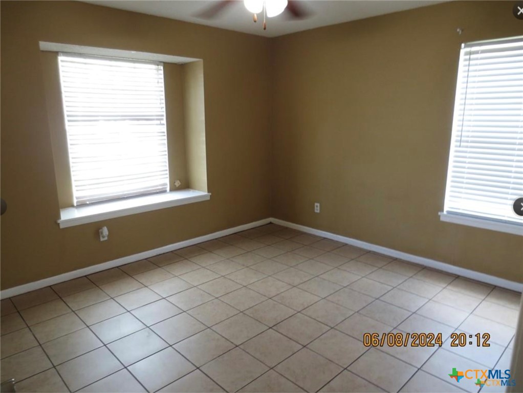 205 Avalon Drive Victoria, TX 77901 - Photo 2 of 9 an empty room with windows