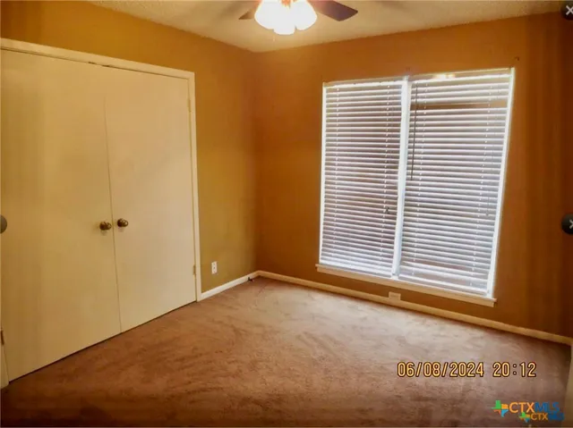 a view of a room that has a window in it