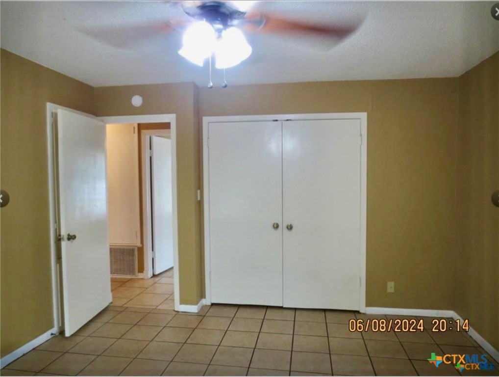 205 Avalon Drive Victoria, TX 77901 - Photo 6 of 9 wooden floor in an empty room with a bathroom