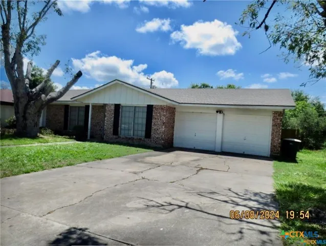 a front view of a house with yard